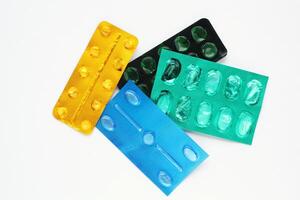 Colorful blister packs of pills, representing medication and healthcare. Variety of colors, symbolizing different types of drugs or dosages photo