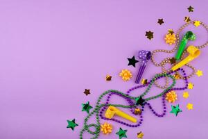 Vibrant Mardi Gras background with mask, beads, and festive decorations photo