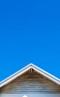 Minimalist Architectural Roof Against Clear Blue Sky Capturing Simplicity and Modern Design photo