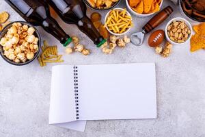 Beer and different snacks for Superbowl or football party photo