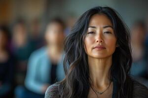 Asian woman meditating with closed eyes during yoga class with inner calm photo