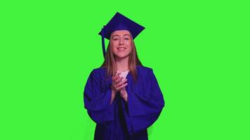 Graduated student clapping hands on green screen video