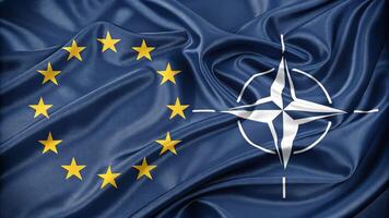 European Union and NATO Flags Representing Unity and Cooperation photo