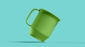 tilted green mug in blue scene, bottom view photo