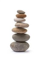stack of balanced stones on white background photo