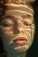 A woman's face is reflected in the water photo