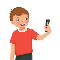Cute little boy taking selfie with smartphone with happy expression vector