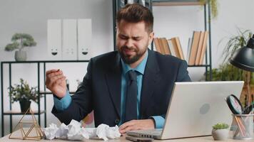 Angry furious man working at home office throwing crumpled paper, having nervous breakdown at work video