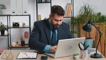 Irritated tired businessman working on laptop website problem, computer virus data loss by hacking video