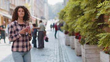 Tourist traveler woman girl using looking smartphone search a way on map in mobile navigator app video