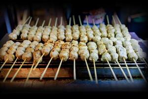 Top view of Pork meatballs grill on a charcoal stove photo