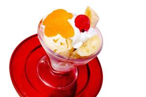 Top view of parfe Fruit ice cream on red plate photo