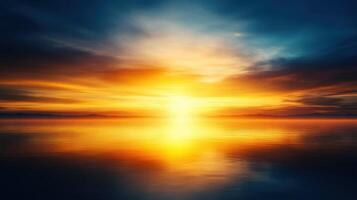 Stunning golden sunrise over calm water, reflecting vibrant colors photo