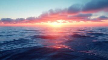 A sunset over the ocean with clouds in the sky photo