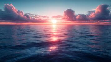 Sunset over the ocean with clouds and water photo