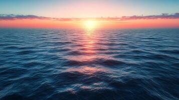 The sun setting over the ocean photo