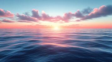 A beautiful sunset over the ocean with clouds photo