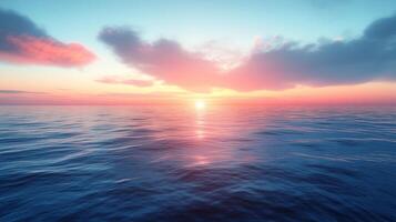 A sunset over the ocean with clouds and water photo
