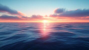 A sunset over the ocean with clouds and water photo