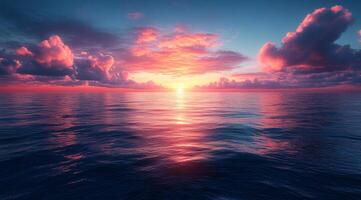 Sunset over the ocean with clouds and water photo