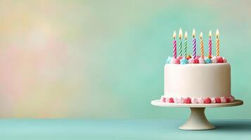 White Birthday Cake with Colorful Candles on Light Background photo