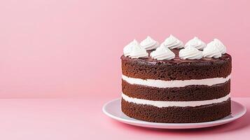 Delightful Chocolate Cake with Whipped Cream on Pink Background photo