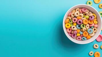 Colorful Cereal Bowl with Fun Shapes and Bright Colors on Blue Background photo