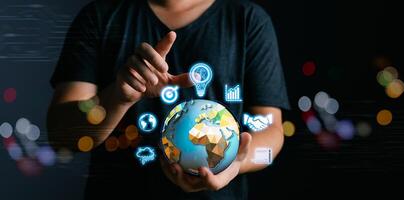 Businessman hold global to plan. banking and financial , Business global internet connection application technology and digital marketing, cloud computing,big data, Digital link tech. photo