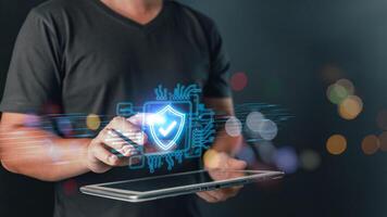 Cybersecurity and privacy protection network security computer and safe data concept. Businessmen protect personal data information from viruses on a taplet with virtual screen interfaces. photo