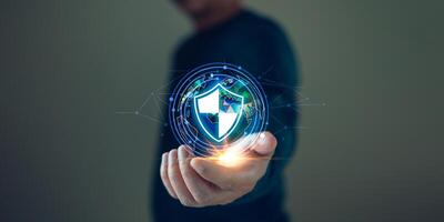 Businessmen protect personal data information from viruses on a laptop with virtual screen interfaces. Cybersecurity and privacy protection network security computer and safe data concept. photo