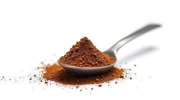 Ground instant coffee in a spoon isolated on white background photo
