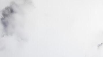 Minimalist abstract composition featuring delicate gray ink blots on a pristine white background photo