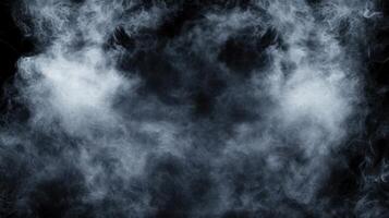 Billowing clouds of smoke rise against a black background, creating a sense of mystery depth photo