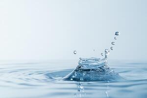 Water droplet splashing, creating ripples and droplets mid-air in a clean and serene scene photo