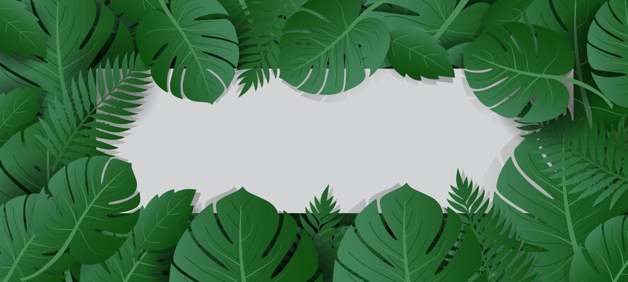green tropical leaves with blank paper on the left side