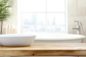 Light wood table and white sink in a bathroom setting with a white bathtub and plant visible photo