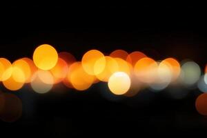 Abstract bokeh light, a blurred arrangement of bright, round shapes on a dark, black background photo