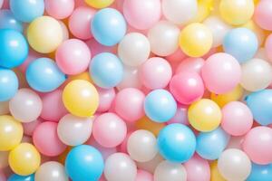 A delightful arrangement of pastel balloons in pink, blue, white, and yellow hues filling the frame photo