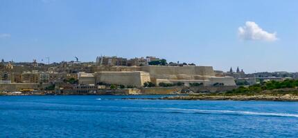View from the Valletta City Gate bridge to Valletta Ditch and St. John's Bastion in Valletta, Malta. photo