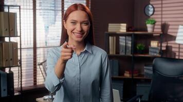 Portrait smiling positive happy success Caucasian girl student business woman female worker businesswoman in office looking at camera pointing in front showing thumb up support good job gesture fine video