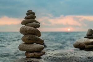Rocks, Sunset, Beach - Balanced stones on the beach at sunset, symbolizing peace and tranquility. photo
