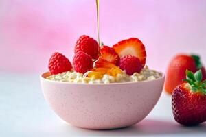 Delicious oatmeal bowl with fresh berries and honey drizzle photo