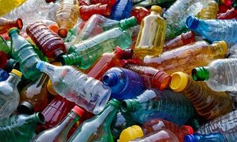 Heap of used empty multicolor plastic bottles, separate waste collection, environmental pollution photo