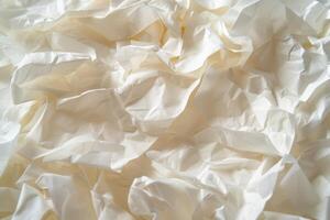 Textures come alive with the delicate crinkles of white paper, inviting a closer look at the play of light and shadow across its surface photo