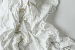 Delicate folds and wrinkles create a captivating white background that invites creativity and artistic expression in design photo
