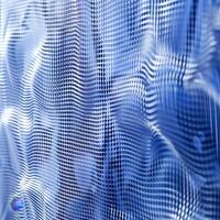 Close proximity reveals a detailed blue and white mesh pattern featuring a wavy, textured surface that catches light beautifully, creating striking visual interest photo