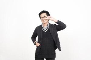 A man in glasses and a sweater is making a peace sign photo