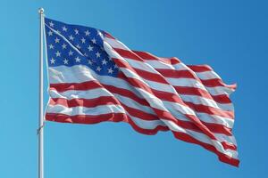 Flying high in the clear blue sky, a symbol of freedom and unity waves gently in the breeze. photo