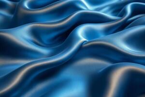 Elegant blue silk drapes softly under gentle light in a captivating display of texture and sheen. photo