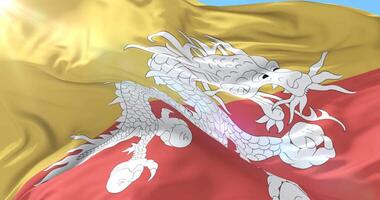 Bhutan flag waving at wind in slow with blue sky, loop video